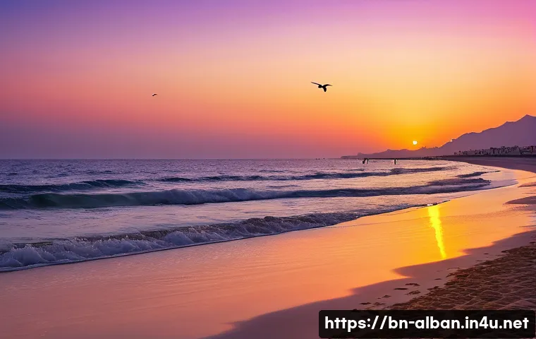 두러스 해변 명소 - A serene and expansive view of the Duraz beach at sunset, showcasing the deep blue sea merging with ...